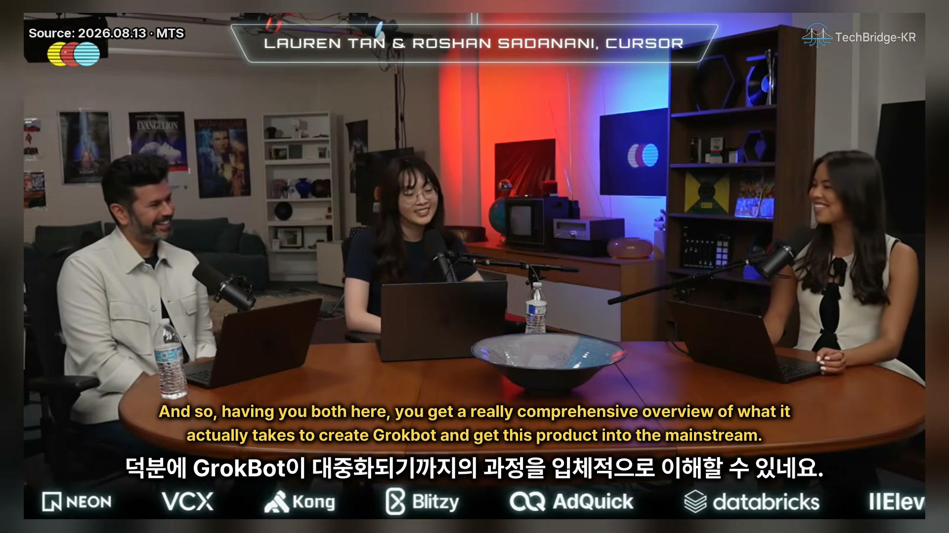 장면 6 — Grokbot 대중화 과정을 설명하는 진행자